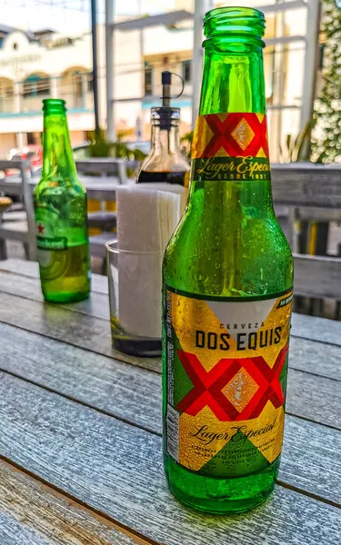 stock image Playa del Carmen Quintana Roo Mexico 22. July 2021 Dos Equis XX beer bottle on a table in Playa del Carmen Quintana Roo Mexico.