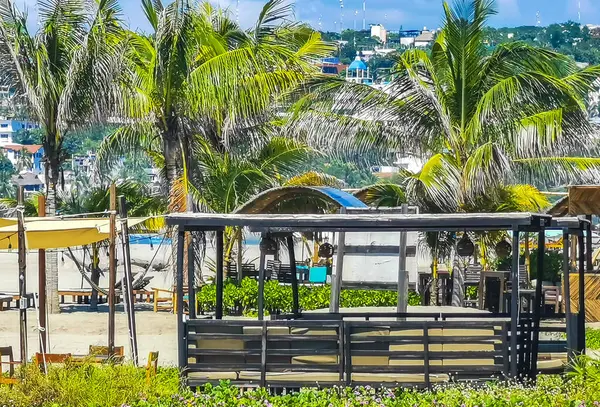 stock image Restaurant restaurants bar bars shops hotels palms palm trees and promenades on the beach in Zicatela Puerto Escondido Oaxaca Mexico.