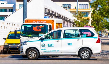 White turquoise taxi cab car cars vehicle taxis cabs in Playa del Carmen Quintana Roo Mexico. clipart