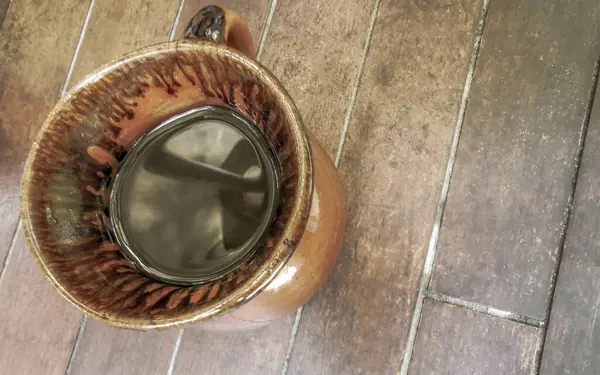 stock image Glass pot cup of americano black coffee with spoon and plate on a table food and drink in the restaurant cafe in Playa del Carmen Quintana Roo Mexico.