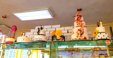 Colorful pies cakes and cookies in a bakery cafe in Alajuela Costa Rica in Central America. clipart