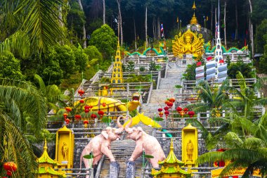 Ao Nang Krabi Thailand 19. October 2018 Wat Phu Khao Phra Maha Phothisat Chinese temple on the hill with many stairs in Ao Nang Amphoe Mueang Krabi Thailand in Southeast Asia. clipart