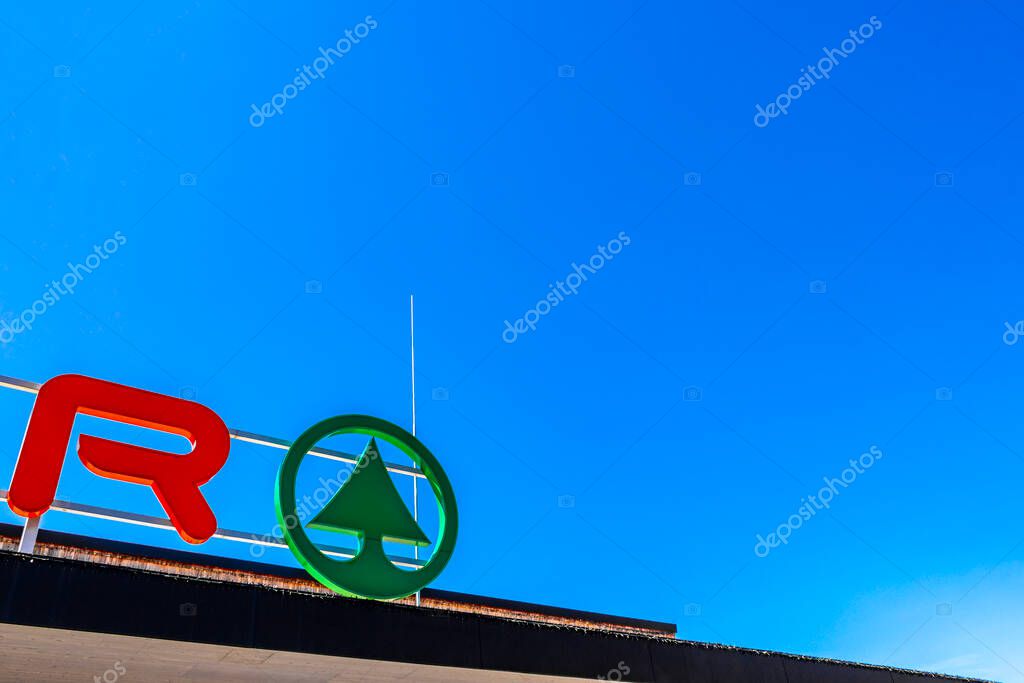 Imst Tyrol Austria 31. May 2025 Interspar supermarket brand logo red and green welcome sign at the entrance in the Alps Imst Tyrol Austria.