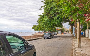 Rio de Janeiro State of Rio de Janeiro Brazil 17. October 2020 Urca village coastal and beach promenade with street sidewalk bars restaurants and people in Rio de Janeiro Brazil.