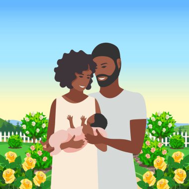 Mutlu bir aile çiftinin çiçek açan bir bahçede çocuğuna şefkatle ve dikkatle sarılmasının temsili bir temsili. Aile günü, sevgi dolu ebeveynler, mutlu bir çocukluk.