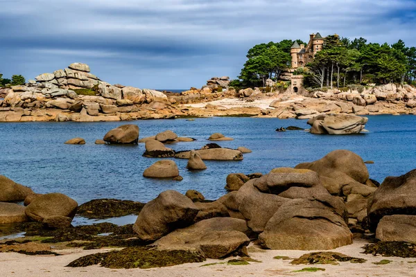 stock image Sandy Beach And Pink Granit Boulders At The Atlantic Coast Of Ploumanach In Brittany, France