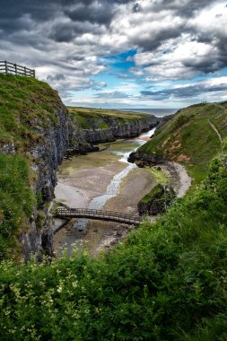 Narrow Canyon And Entrance To Smoo Cave, Hideout Of Bonnie Prince Charles, At The Atlantic Coast Near Durness In Scotland, UK clipart