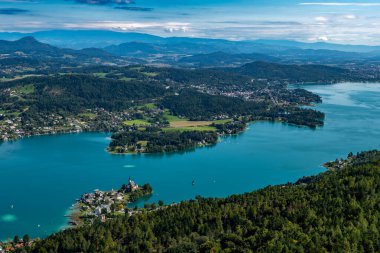 View Over Lake Woerthersee(Wrther See) And Village Maria Woerth On Peninsula In Carinthia In Austria clipart