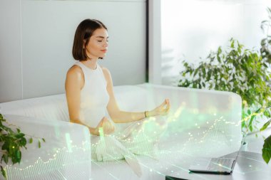 Woman doing yoga in the office. Business person relaxing and meditating. clipart