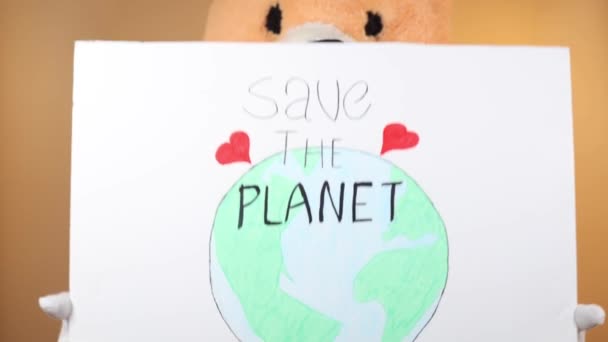 Man Head Teddy Bear Points Sign Says Planet Isolated Yellow — Video
