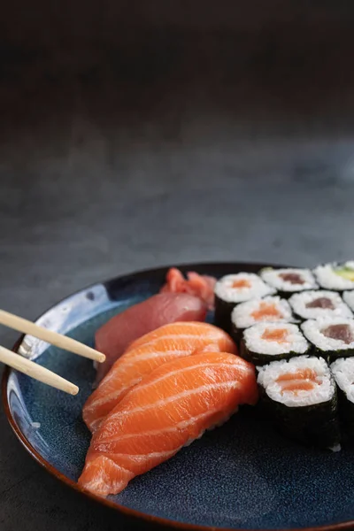 Delicious Sushi Rolls Served Rustic Table Chopsticks Jogdíjmentes Stock Fotók