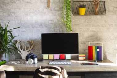 Workspace for professional photographer.Workplace for photo retouching in modern studio.DSLR camera,tablet with pen for retouching images.