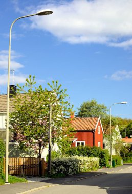 Swedish middle class home against blue sky clipart