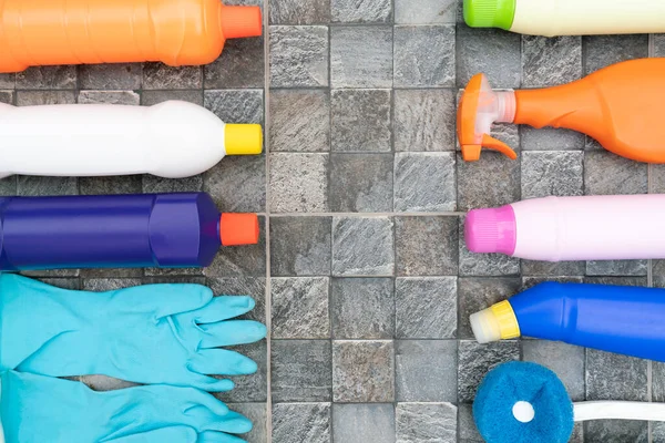 House cleaning plastic product on tile stone floor background, home service or housekeeping concept