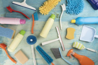 House cleaning plastic product on blue table background, home service or housekeeping concept