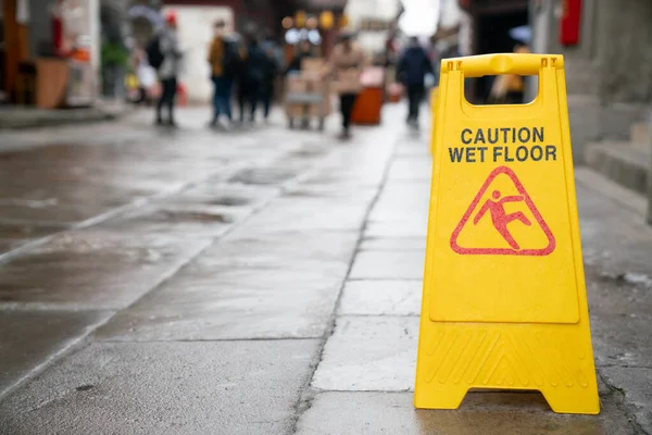 close up of warning sign for caution wet floor