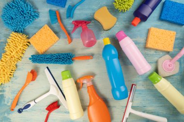 House cleaning plastic product on blue table background, home service or housekeeping concept