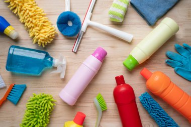 House cleaning plastic product on wooden table background, home service or housekeeping concept