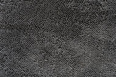Kumaş kumaş siyah doku arkaplanı, kumaş tekstil yüzeyinin soyut görüntüsü.