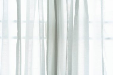 close up of white curtain in the room at home with sunlight