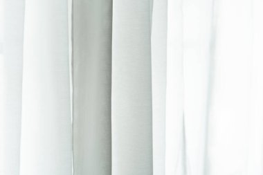 close up of white curtain in the room at home with sunlight