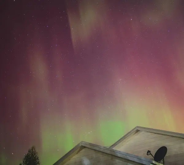 stock image aurora australis or southern lights visible from Tasmania's clear night sky full of stars and constellations, shot in May 2024, geomagnetic storm event