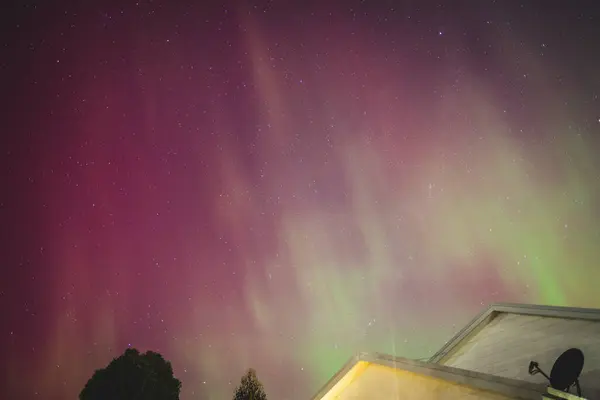 stock image aurora australis or southern lights visible from Tasmania's clear night sky full of stars and constellations, shot in May 2024, geomagnetic storm event
