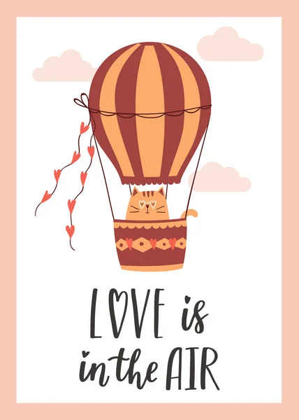 stock vector Valentine's Day greeting card with a cute cat flying on a hot air balloon. The handwritten phrase Love is in the air. Hand lettering. Cartoon vector illustration isolated on a white background