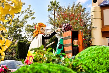 Osaka,Japan - Nov 5,2021 : Statue of Kyojuro Rengoku and Tanjiro Kamado : Demon Slayer(