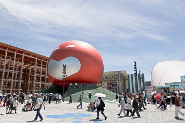 OSAKA, JAPAN - AUGUST 22, 2025 : Editorial photograph of the exteriors of various pavilions and exhibits showcasing a vision of the future at the 2025 Osaka, Kansai Expo.