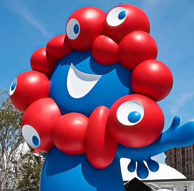 OSAKA, JAPAN - AUGUST 22, 2025 : Editorial photograph of the exteriors of various pavilions and exhibits showcasing a vision of the future at the 2025 Osaka, Kansai Expo.