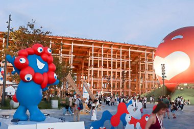 OSAKA, JAPAN - AUGUST 22, 2025 : Editorial photograph of the exteriors of various pavilions and exhibits showcasing a vision of the future at the 2025 Osaka, Kansai Expo.
