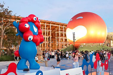 OSAKA, JAPAN - AUGUST 22, 2025 : Editorial photograph of the exteriors of various pavilions and exhibits showcasing a vision of the future at the 2025 Osaka, Kansai Expo.
