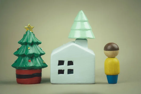 Christmas little houses and trees with human. Decorative figurines of a Christmas theme