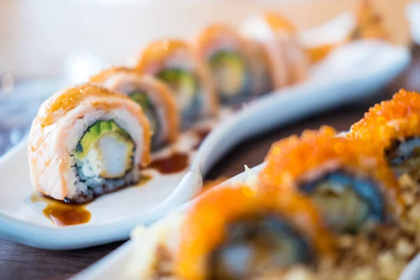 stock image Tasty sushi roll and avocado served on a plate. Japanese food.