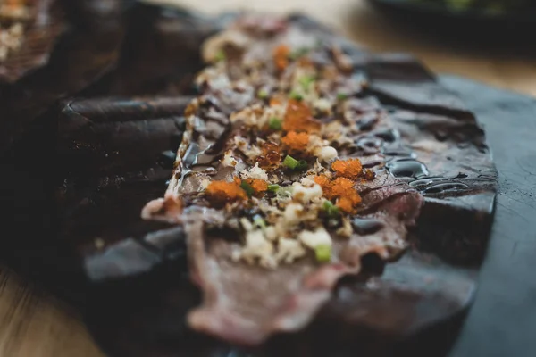 stock image Close up of Wagyu Hoba Yaki beef grilled on dried leaf. Japanese food style