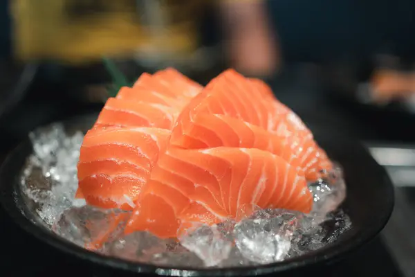 stock image Salmon sashimi slice fresh serve on ice. Japanese traditional food or with low calories and high nutrition and healthy diet dish.