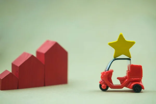 Stars on red car to the evaluation of home. The concept of the best housing. Home value concept