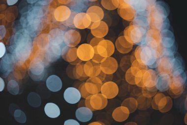 Soyut turuncu ve mavi renkli, Noel arkaplanı için parlak ışık. Bokeh arkaplanı