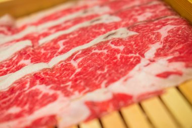 Fresh meat and beautiful texture pattern on wood tray. Selective focus