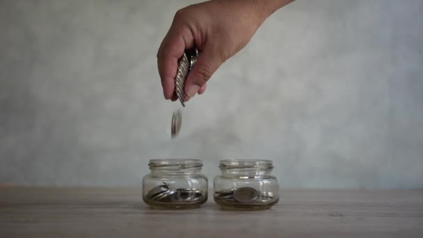 Man Puts Coin Jar Saving Money Future Growth Knowing How — Vídeos de Stock