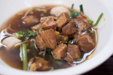 Close up of a bowl of braised beef noodle soup. Thai popular street food
