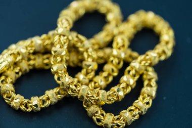 Close up of gold necklaces or gold bracelets