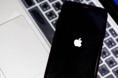 Bangkok, Thailand - March 4, 2023 : A close-up photo of the iPhone with iOS firmware update process on the screen, developed by Apple Inc.