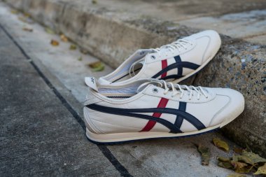 Bangkok, Thailand - March 4, 2023 : New white shoe from Onitsuka Tiger model MEXICO 66 SD. Casual sneakers. Onitsuka Tiger is one of the world most popular Japanese brands.