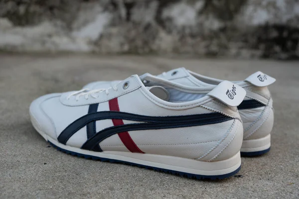 stock image Bangkok, Thailand - March 15, 2023 : New white shoe from Onitsuka Tiger model MEXICO 66 SD. Casual sneakers. Onitsuka Tiger is one of the world most popular Japanese brands.