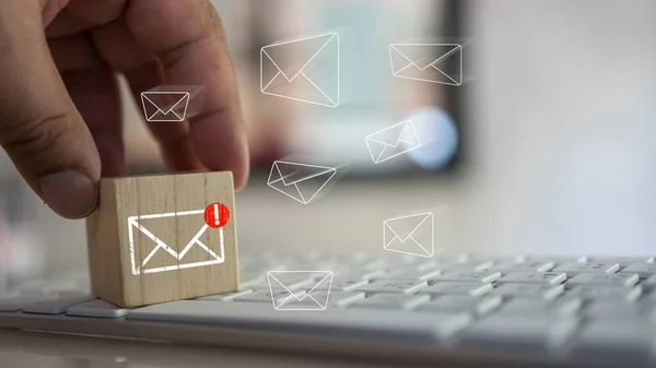 stock image Man touching cube block with envelope and notifications symbol icon for the new E-Mail message inbox. The concept of computer browsing communication