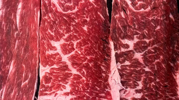 生の牛肉の背景と牛肉の食感 おいしい新鮮な肉の質感や背景 — ストック写真