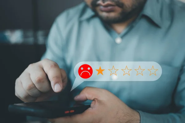 Customer Experience dissatisfied Concept, Unhappy Businessman Client with Sadness Emotion Face on a smartphone screen, Bad review, bad service dislike bad quality, low rating, social media not good.