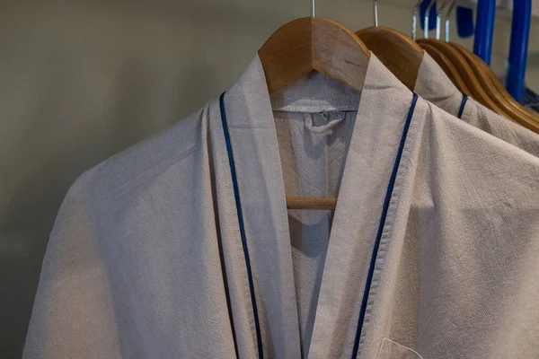 stock image Bathrobes hanging on rack in closet for the hotel guest in room. Selective focus and close up